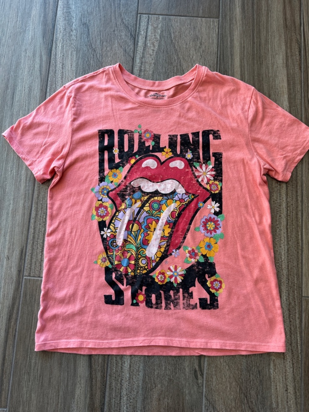 the Rolling Stones Coral Pink Floral Tongue Graphic Tee. Women’s size Small